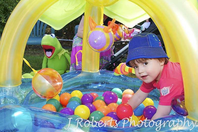 boy playing in ball-pit at birthday party - Party Photography Sydney